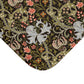 A rectangular microfibre bath mat with a floral pattern inspired by William Morris, predominantly in dark colours with a mix of lilies and other foliage.