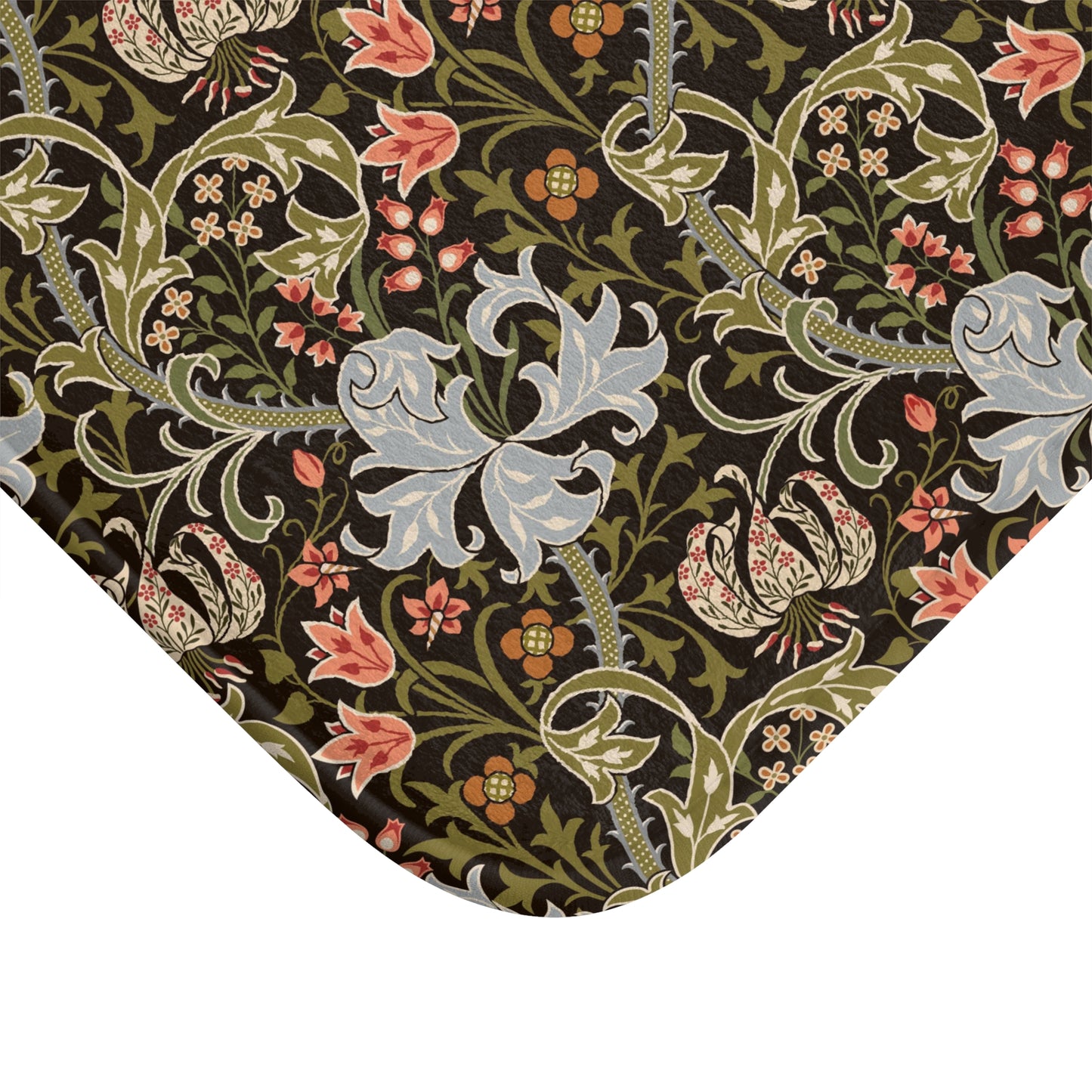 A rectangular microfibre bath mat with a floral pattern inspired by William Morris, predominantly in dark colours with a mix of lilies and other foliage.