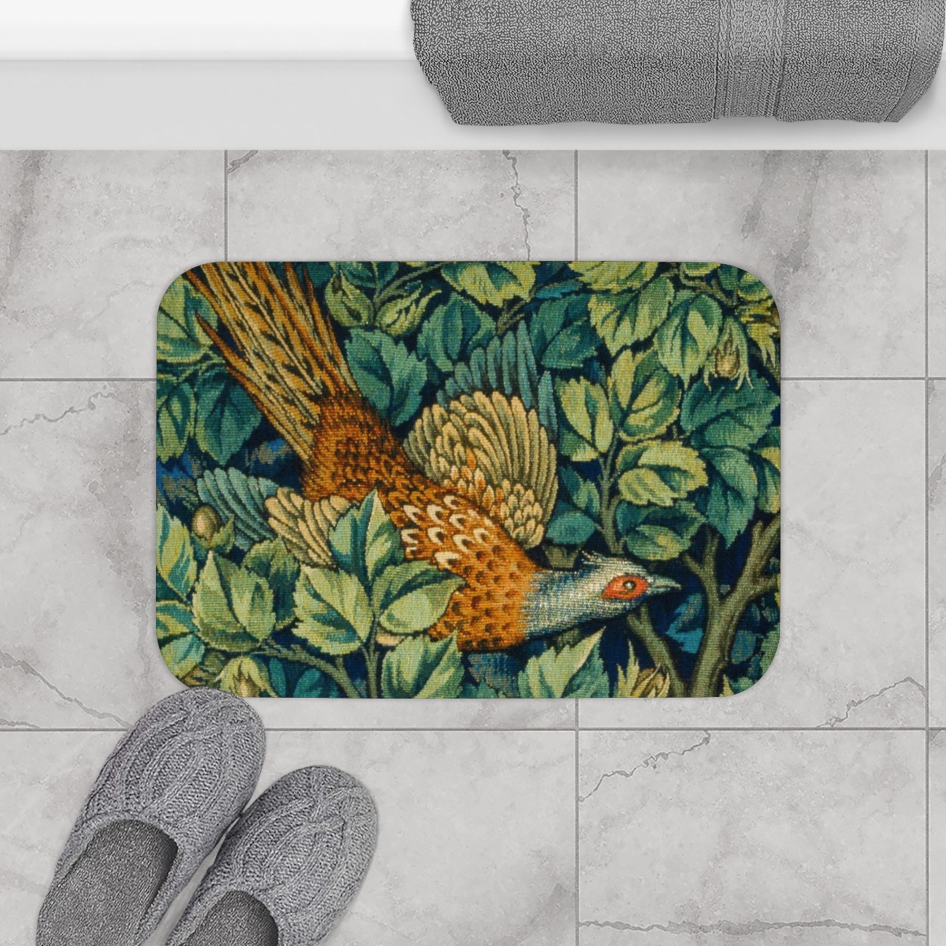 A microfibre bath mat with a William Morris  floral pattern featuring an artistic representation of a pheasant surrounded by leaves.