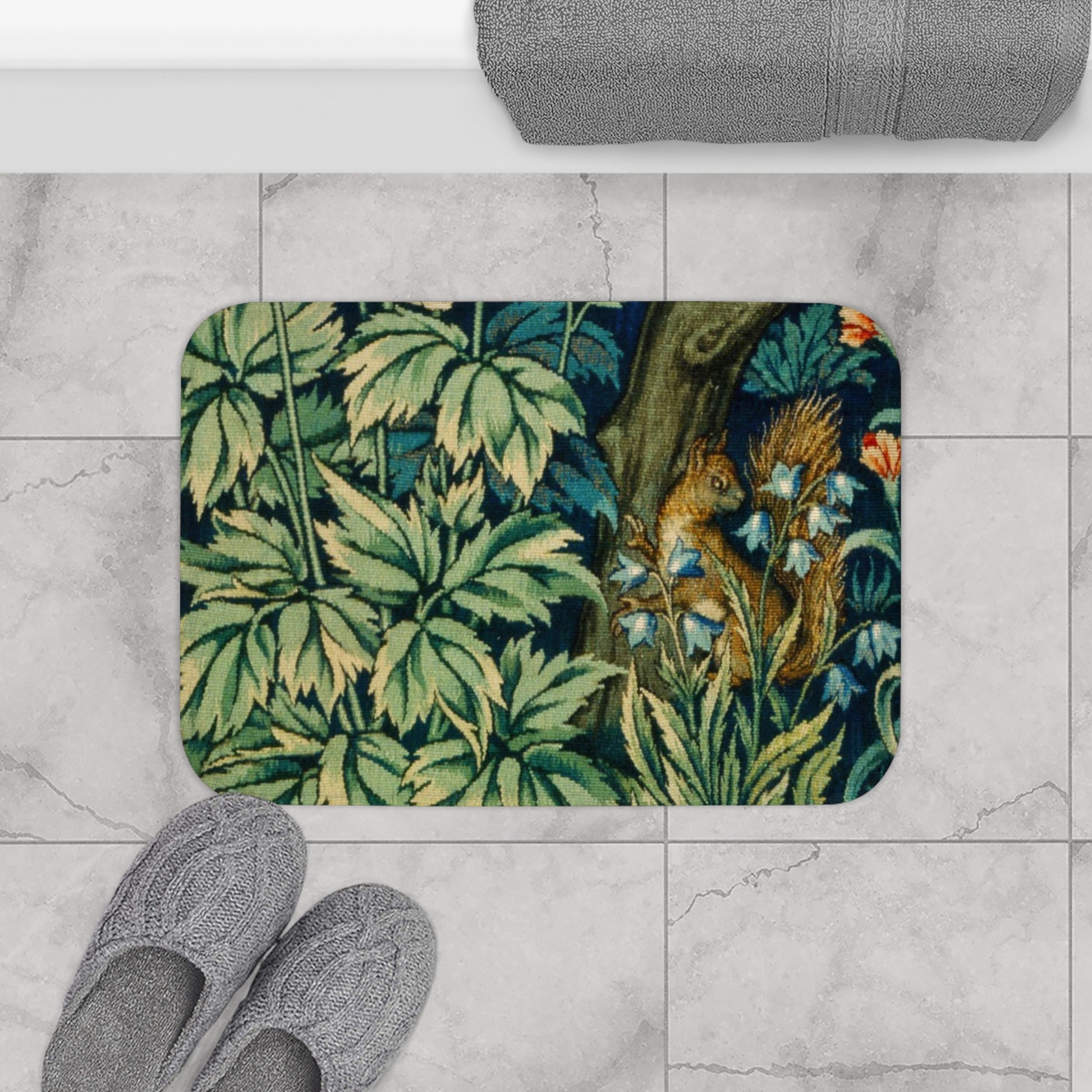 Microfibre bath mat with a William Morris  floral and squirrel design, predominantly in green and brown colours.