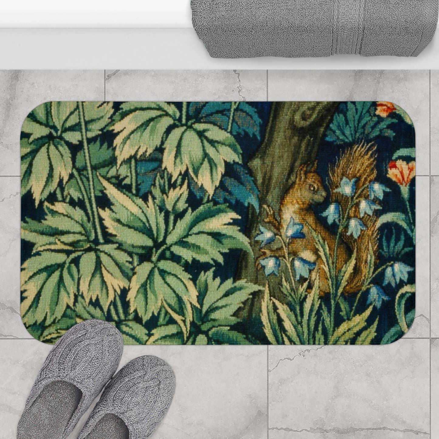 Microfibre bath mat with a William Morris  floral and squirrel design, predominantly in green and brown colours.