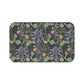 Microfibre bath mat with a floral pattern inspired by William Morris, predominantly yellow flowers with green leaves on a black background.