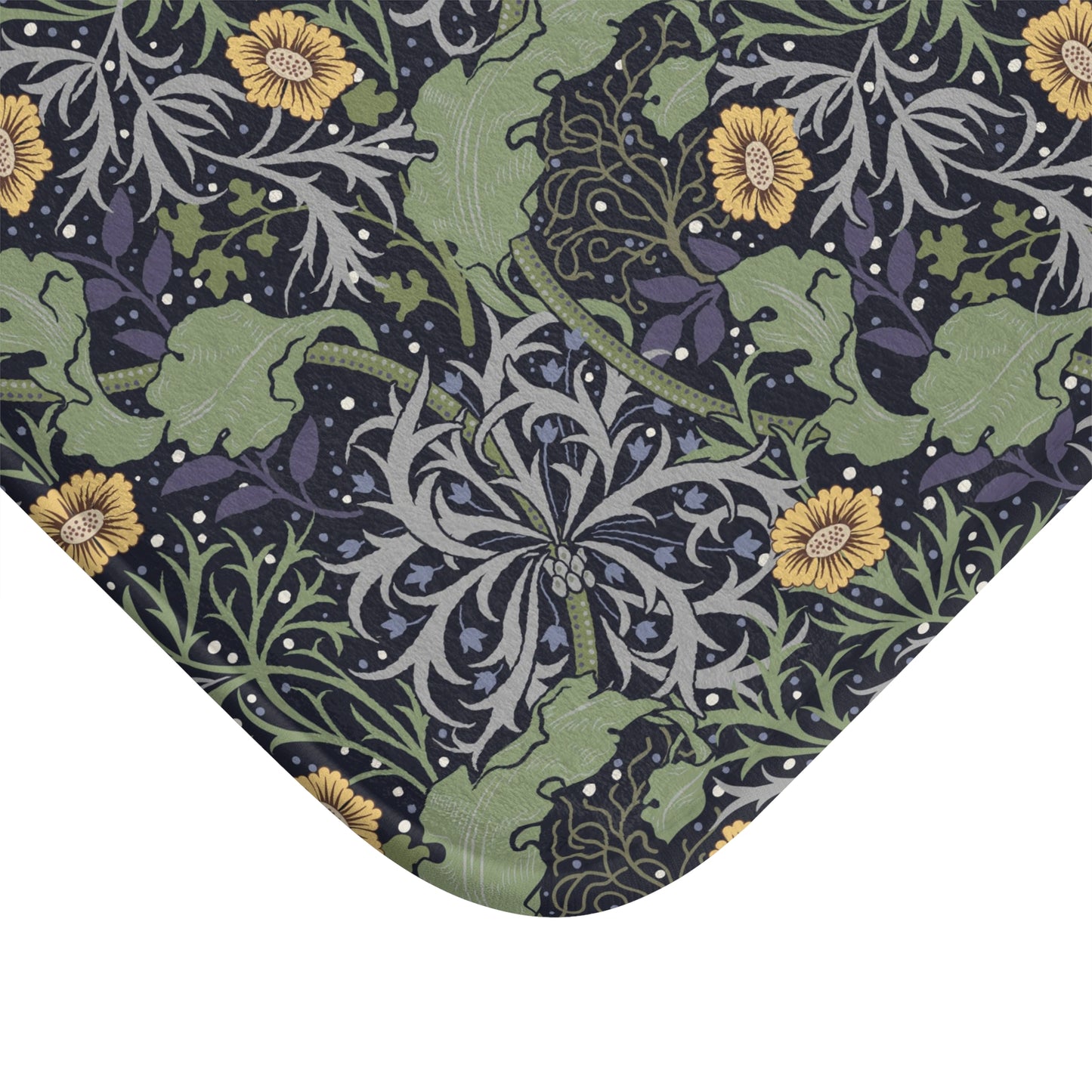 Microfibre bath mat with a floral pattern inspired by William Morris, predominantly yellow flowers with green leaves on a black background.