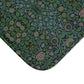 Rectangular microfibre bath mat with a green floral pattern inspired by William Morris design.