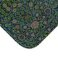 Rectangular microfibre bath mat with a green floral pattern inspired by William Morris design.