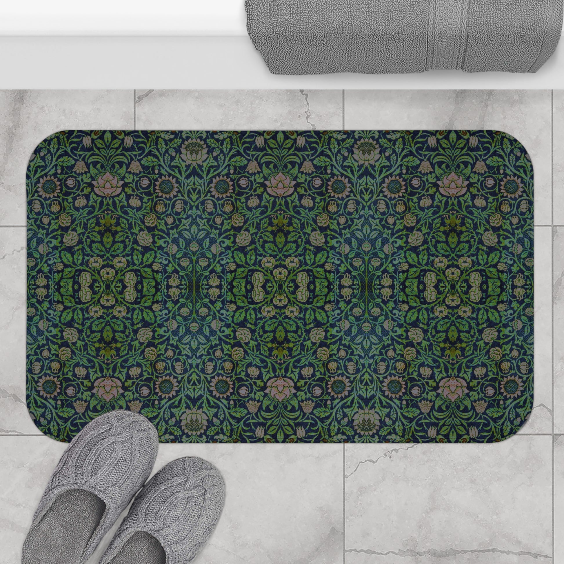 Rectangular microfibre bath mat with a green floral pattern inspired by William Morris design.
