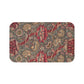 A rectangular microfibre bath mat with a floral pattern inspired by William Morris, predominantly red with a non-slip black border.