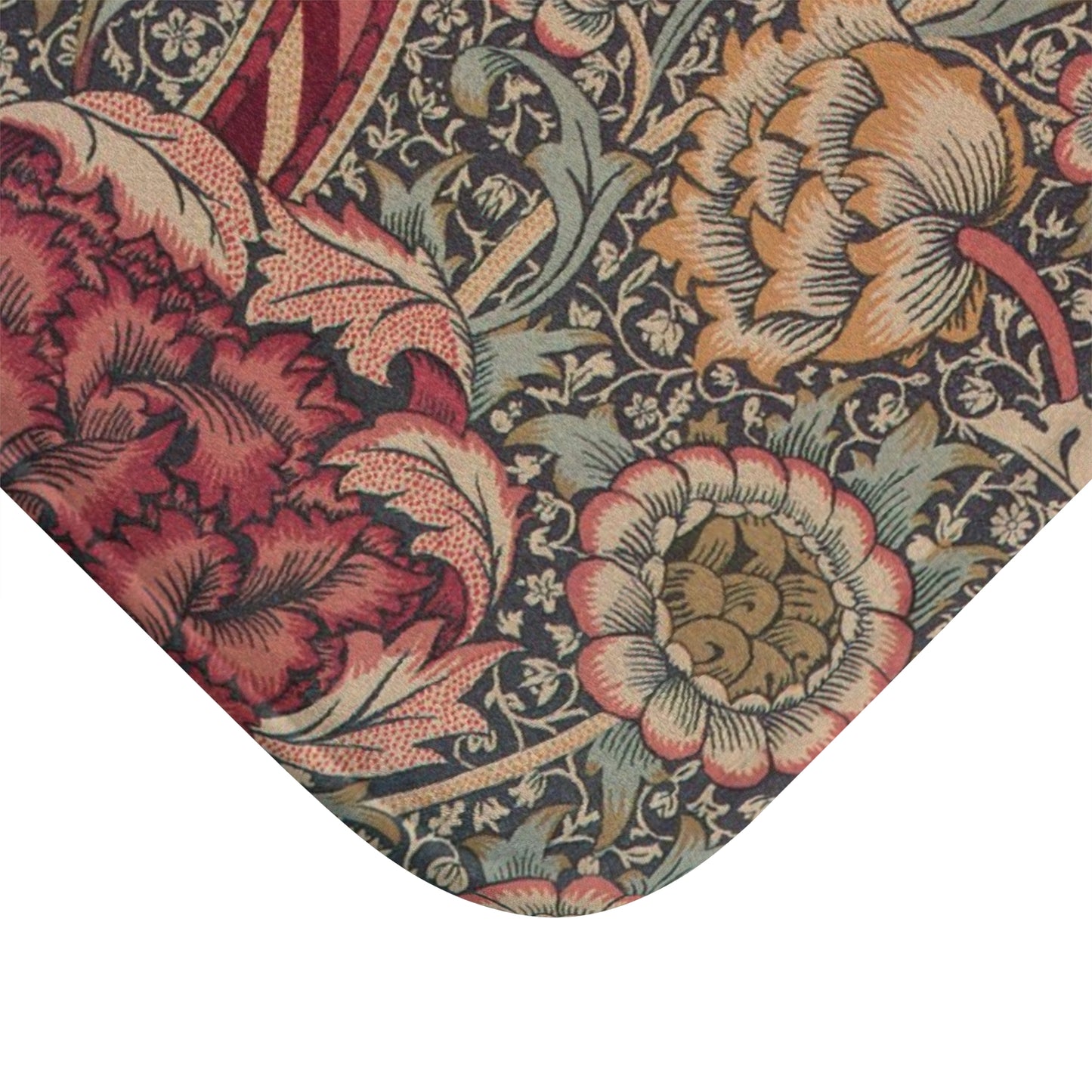 A rectangular microfibre bath mat with a floral pattern inspired by William Morris, predominantly red with a non-slip black border.