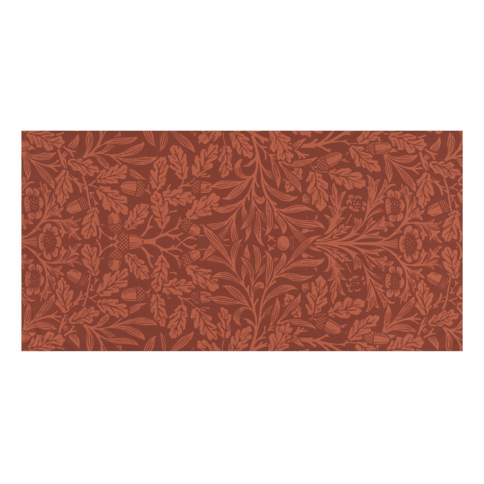 A rectangular textile or mat featuring an all-over botanical pattern in terracotta and rust tones, shown flat against a plain white background.
