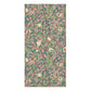 A rectangular bath towel featuring a repeating botanical and bird pattern on a dusty pink background, with green leaves, brown branches, cream pomegranate fruits, and small birds in beige and brown tones.h towel