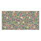 A rectangular bath towel featuring a repeating botanical and bird pattern on a dusty pink background, with green leaves, brown branches, cream flowers, and small birds in beige and red.