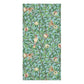 A rectangular bath towel featuring a repeating botanical pattern of green leaves, brown branches, cream pomegranate fruits, and small birds on a light blue-green background.