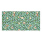 A rectangular bath towel featuring a repeating botanical pattern of green leaves, small pomegranate-like fruits, birds, and branches on a light aqua background.