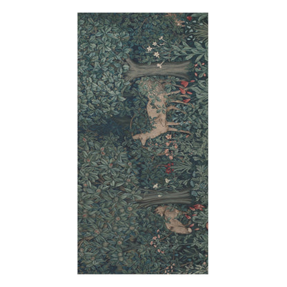 A vertical rectangular bath towel featuring an ornate forest scene with dense green foliage, brown tree trunks, and small deer figures in muted beige and red accents, shown against a plain white background.