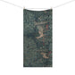 A rectangular bath towel featuring a detailed forest scene with dense green foliage, tree trunks, and small red and white flowers, hanging from a clothesline with wooden clips against a plain white background.