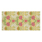 A rectangular bath towel with a repeating floral pattern on a cream background, featuring pink flowers, green leaves, yellow daisies, and orange-brown accents.