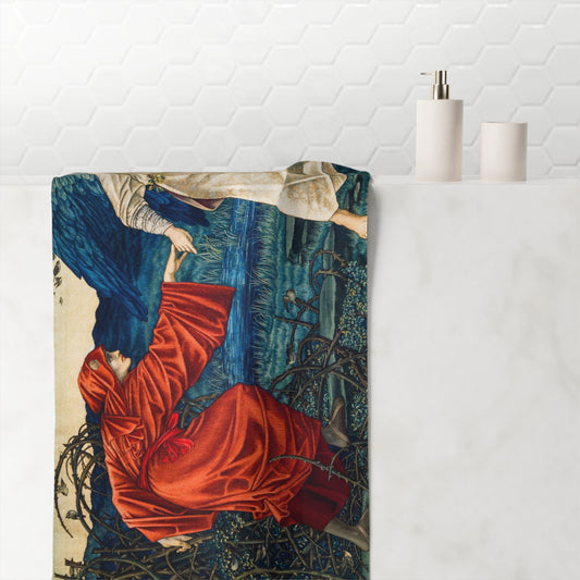 A bathroom towel featuring a detailed art print of a woman in a red gown and blue cloak, draped over a white marble tub with a white hexagonal tile backsplash and minimalist white bottles in the background.