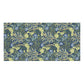 A rectangular bath towel featuring a dense botanical pattern in navy blue, sage green, and light blue, shown against a plain white background.
