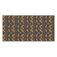A rectangular bath towel with a dense, symmetrical floral and botanical pattern in dark green, rust orange, pink, and cream, shown flat against a plain white background.