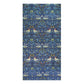 A rectangular bath towel featuring a dense, symmetrical William Morris-style botanical pattern with blue foliage, white birds, and small yellow accents on a white background.