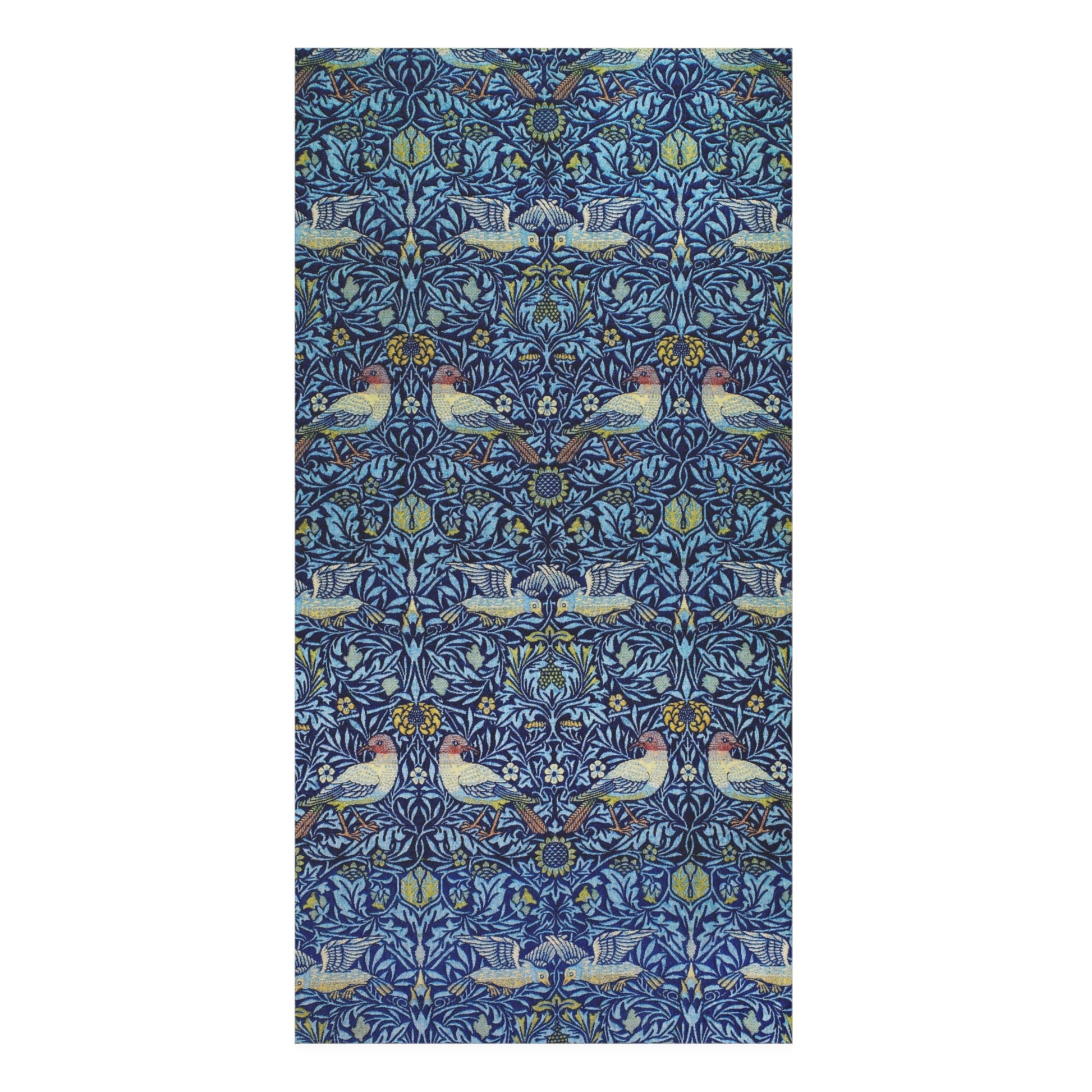 A rectangular bath towel featuring a dense, symmetrical William Morris-style botanical pattern with blue foliage, white birds, and small yellow accents on a white background.