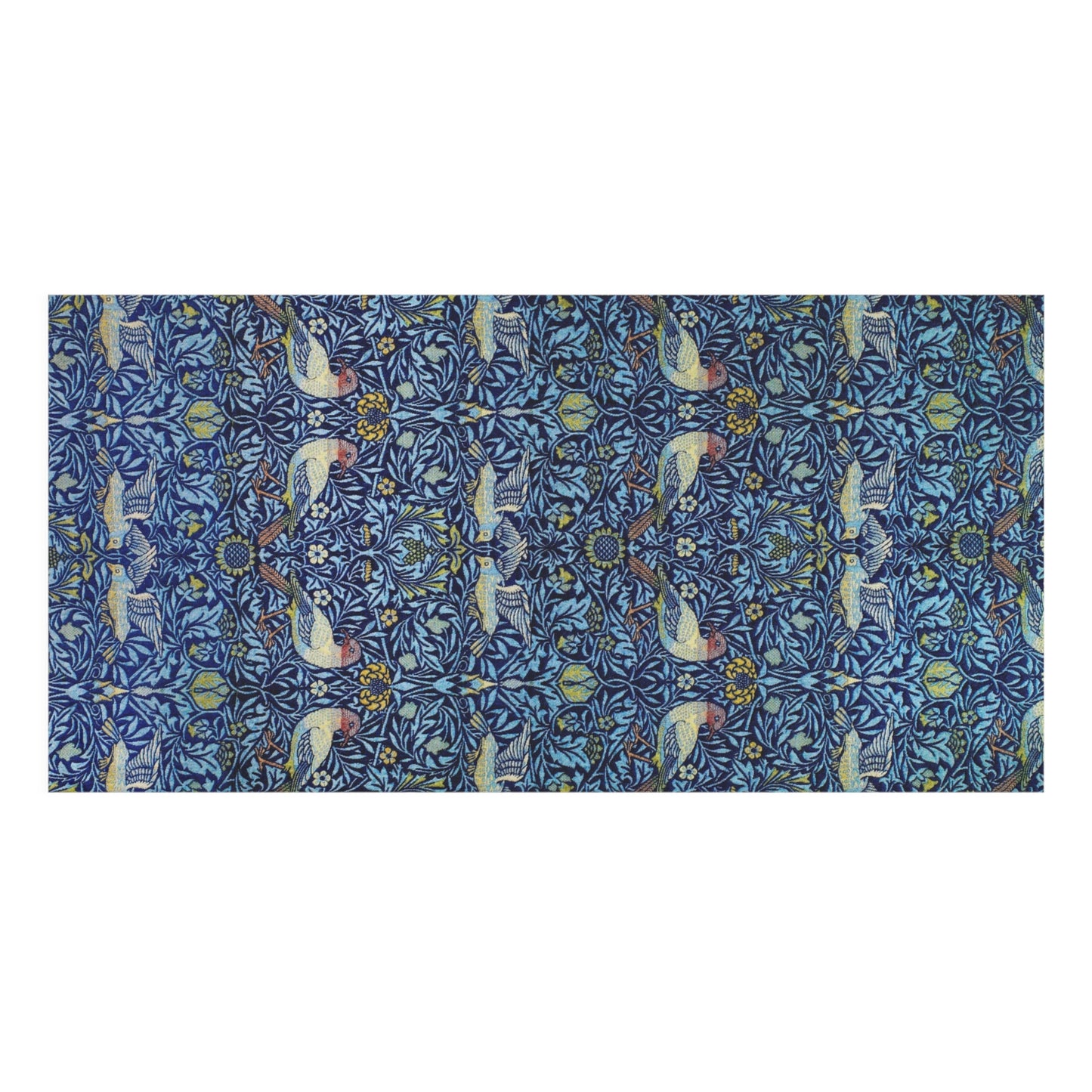 A rectangular bath towel featuring a dense, symmetrical botanical and bird pattern in shades of blue, teal, beige, and brown, presented flat against a solid white background.