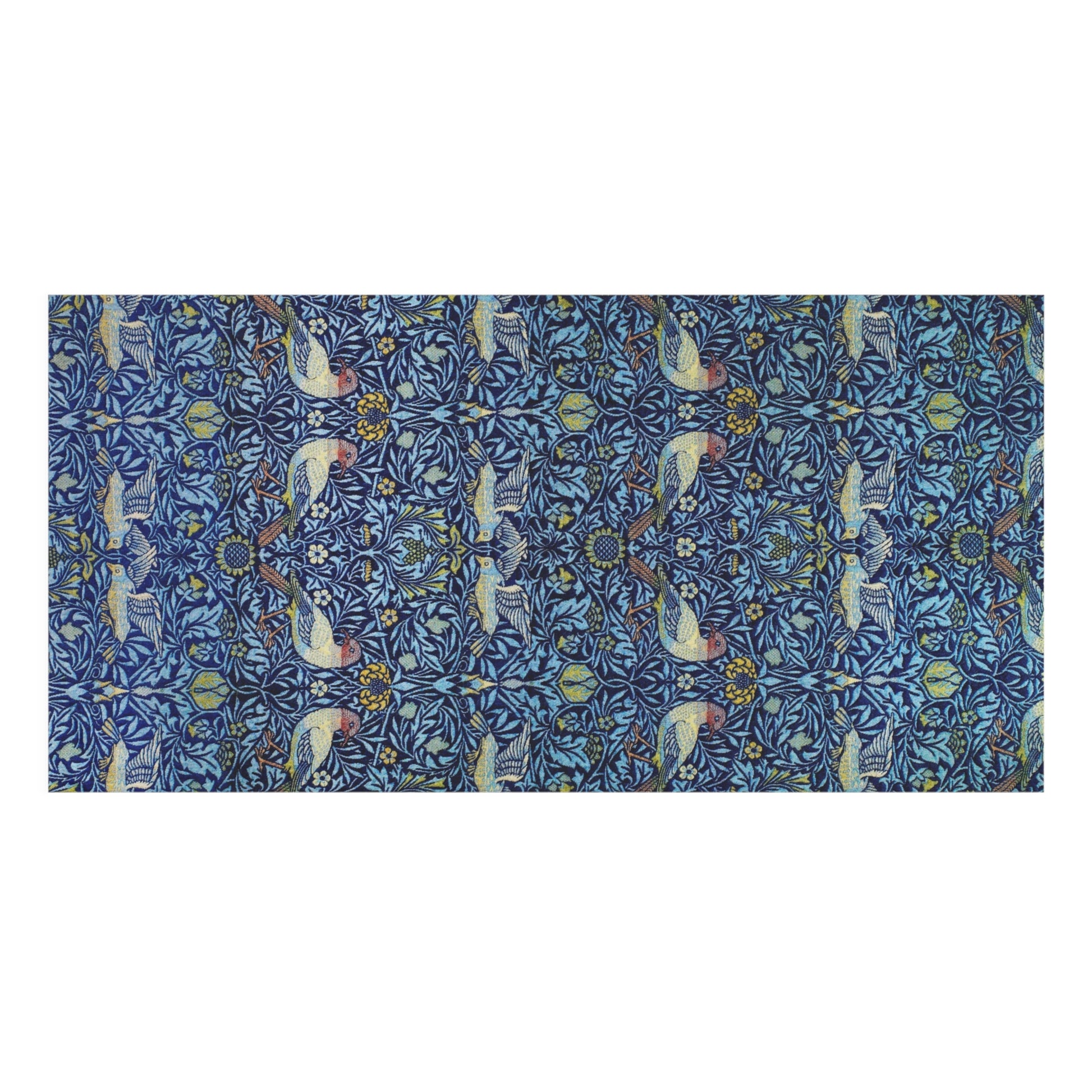 A rectangular bath towel featuring a dense, symmetrical botanical and bird pattern in shades of blue, teal, beige, and brown, presented flat against a solid white background.