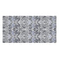 A rectangular bath towel featuring a repeating Victorian-style floral and leaf pattern in muted blue-gray, charcoal gray, and white.