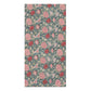 A rectangular towelfeaturing a repeating floral pattern with pink and coral-red flowers, cream blossoms, and pale green stems on a muted blue-gray background.