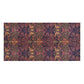 A rectangular area rug featuring a dense, symmetrical botanical and scroll pattern in dark purple, rust orange, sage green, and black.