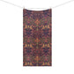 A rectangular textile with an intricate botanical and bird pattern in dark navy, pink, and olive green, hanging from a clothesline with two wooden clips against a plain white background.