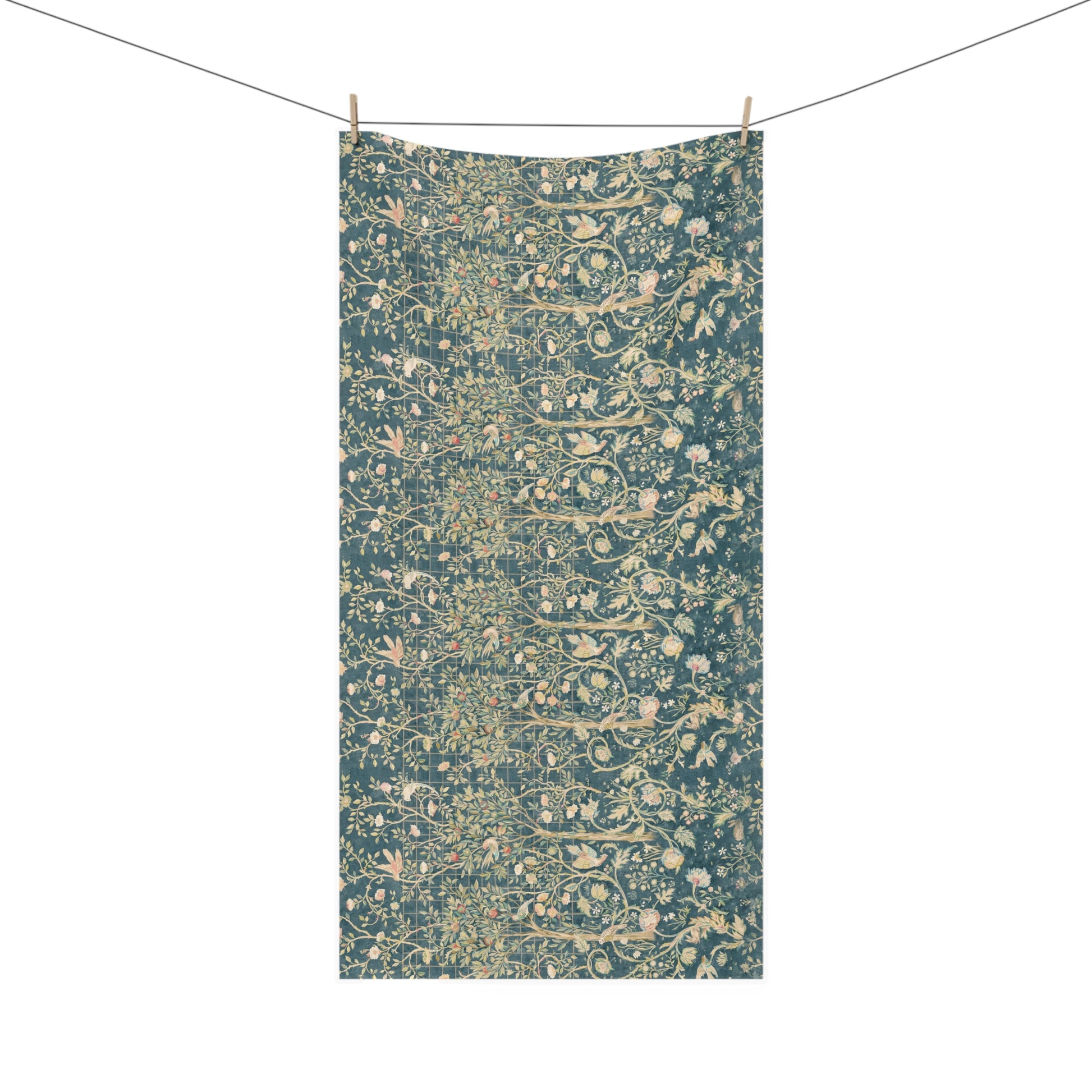 A rectangular textile hanging from a clothesline with two wooden clips, featuring an all-over dense floral and botanical pattern in muted teal, beige, and soft pink tones against a plain white background.