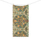 A rectangular textile hanging from a string with two wooden clips, featuring a vintage botanical pattern with yellow flowers, green leaves, and blue accents on a cream background.