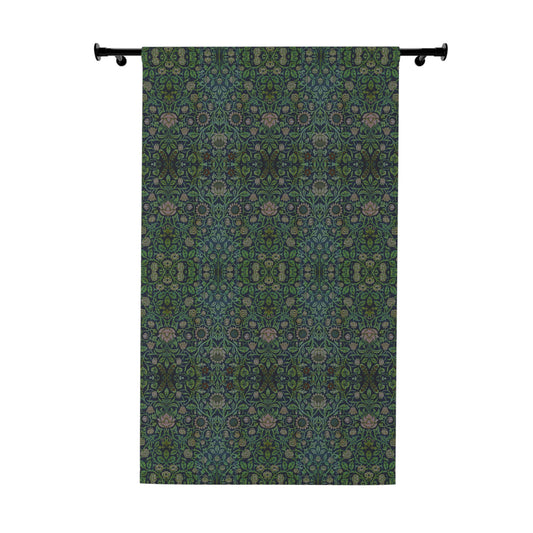 Decorative curtain with a green and blue pattern on a white background