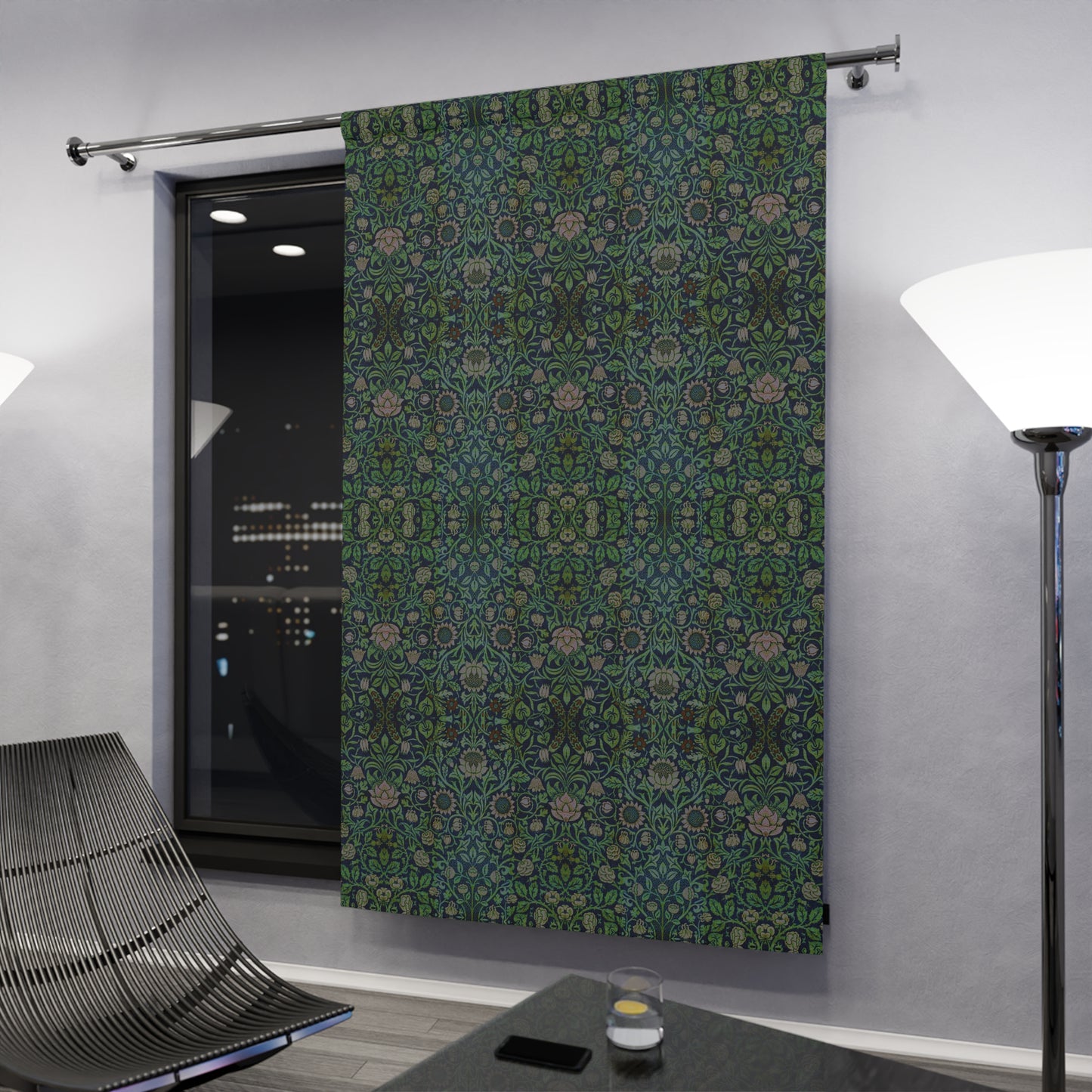 Decorative curtain with green floral pattern in a modern room setting.