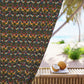 Decorative fabric with floral and bird pattern on a beach setting