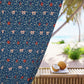 Floral patterned fabric with a beach setting in the background