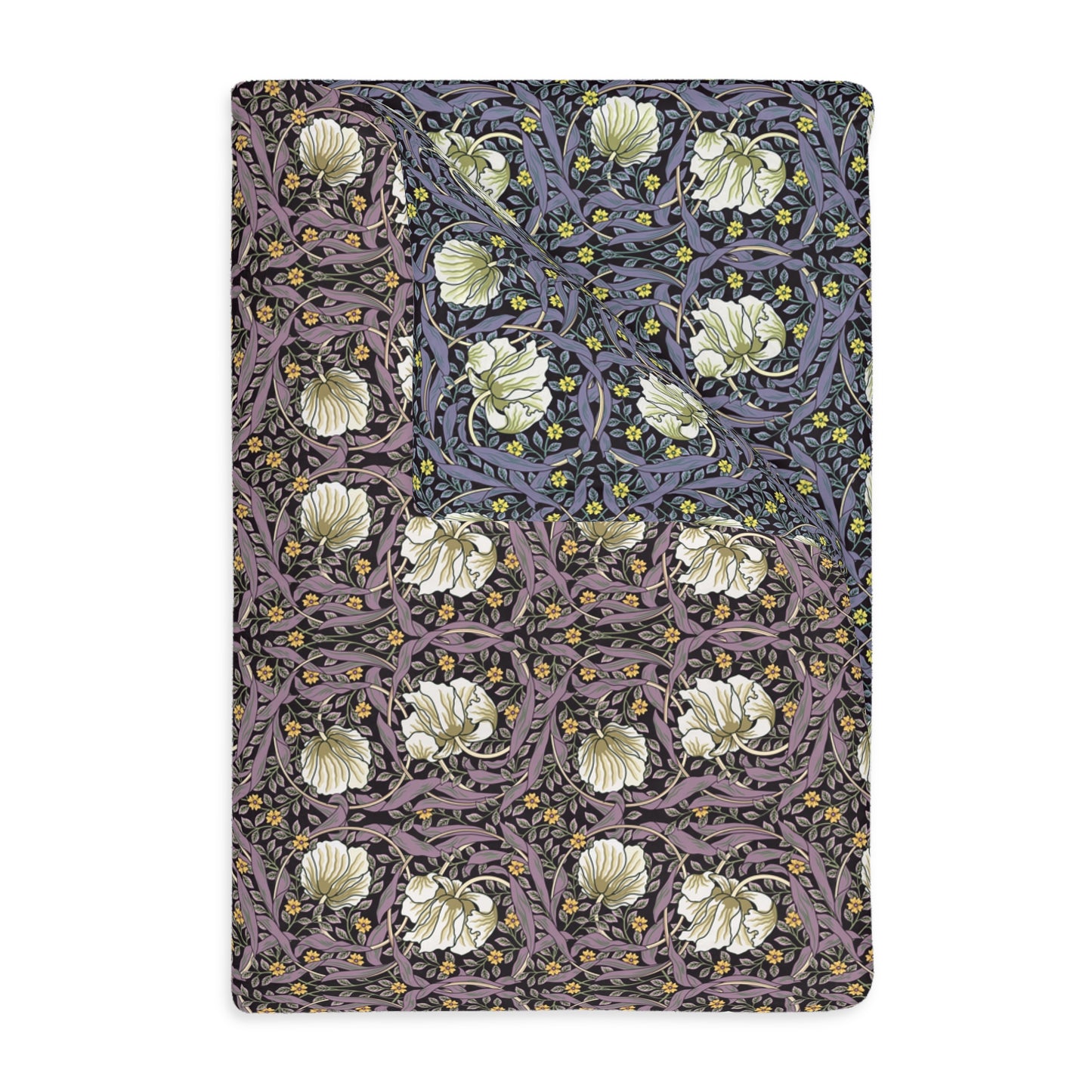 A rectangular blanket with a two-sided print featuring floral designs in shades of rosewood and lavender.