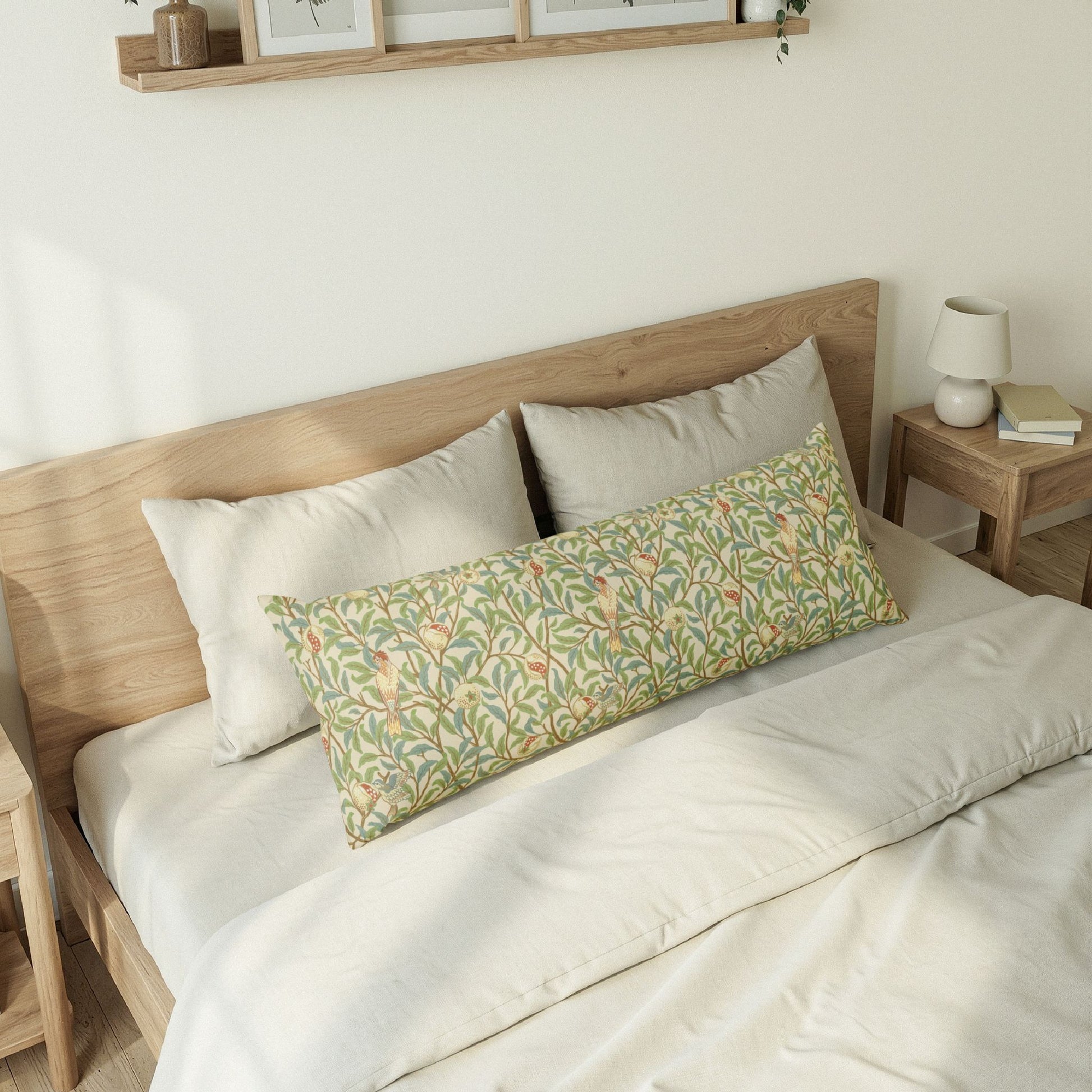 Bedroom with a wooden bed frame and floral patterned pillow