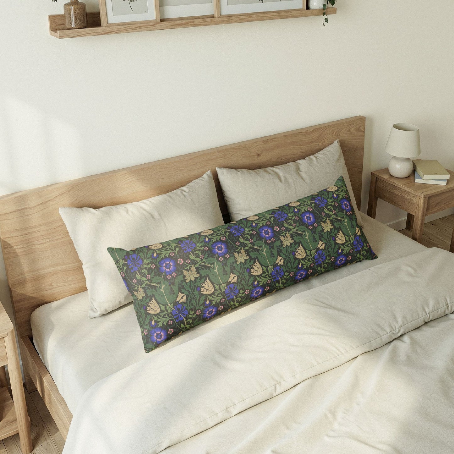 Bedroom with a wooden bed frame and floral-patterned pillow