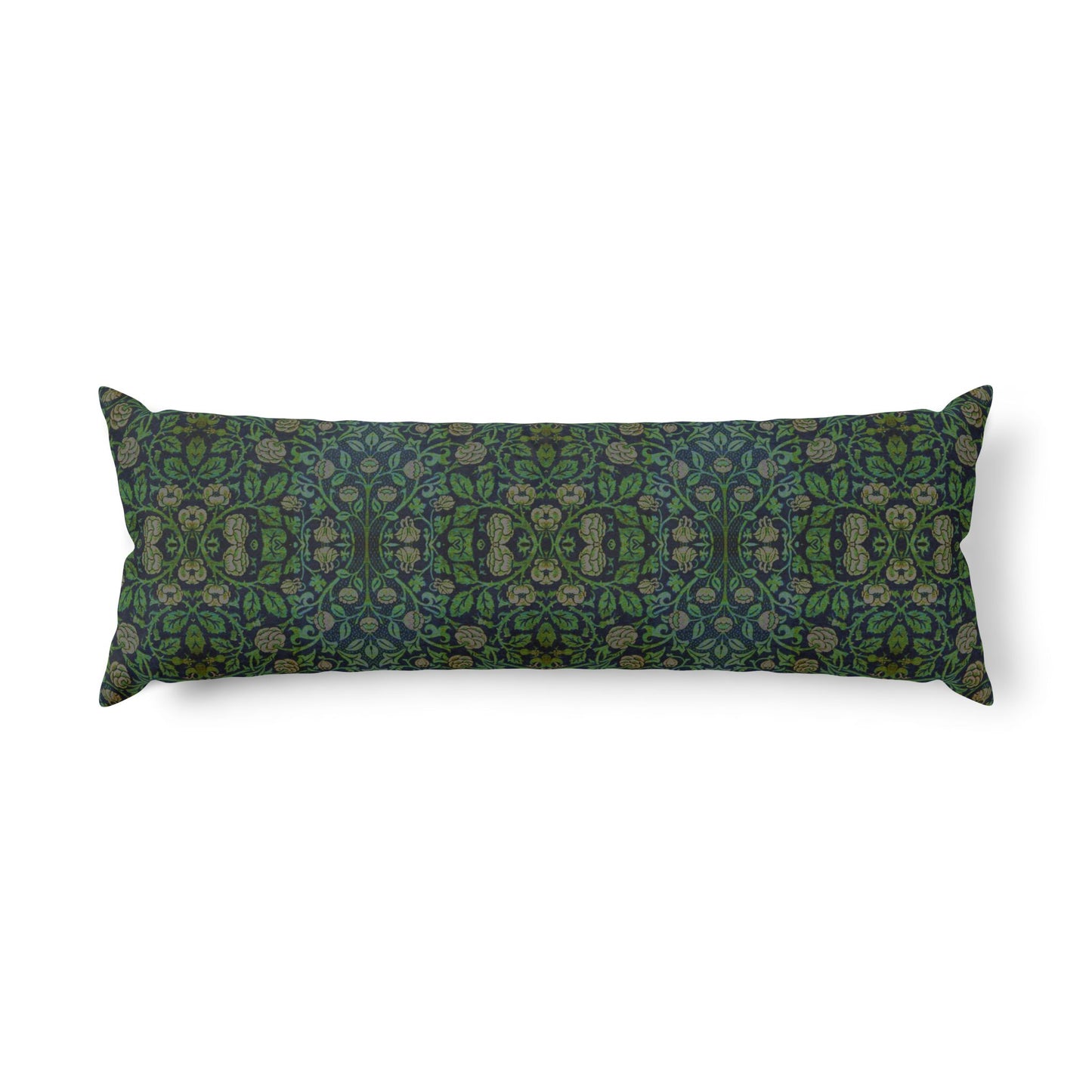 A long rectangular lumbar pillow with an intricate William Morris & Co green and brown paisley pattern rests on a bed with cream bedding and white pillows in a minimalist, warm-toned bedroom.