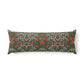 A long rectangular lumbar pillow featuring a dense floral and botanical pattern in olive green, red, pink, and white, set against a plain white background.
