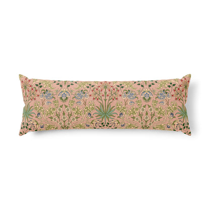 A long rectangular lumbar pillow featuring a dense botanical and floral pattern in muted green, blue, and gold on a dusty pink background, shown against a plain white studio background.