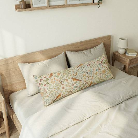 Bedroom with a wooden headboard and cherry-patterned body pillow.
