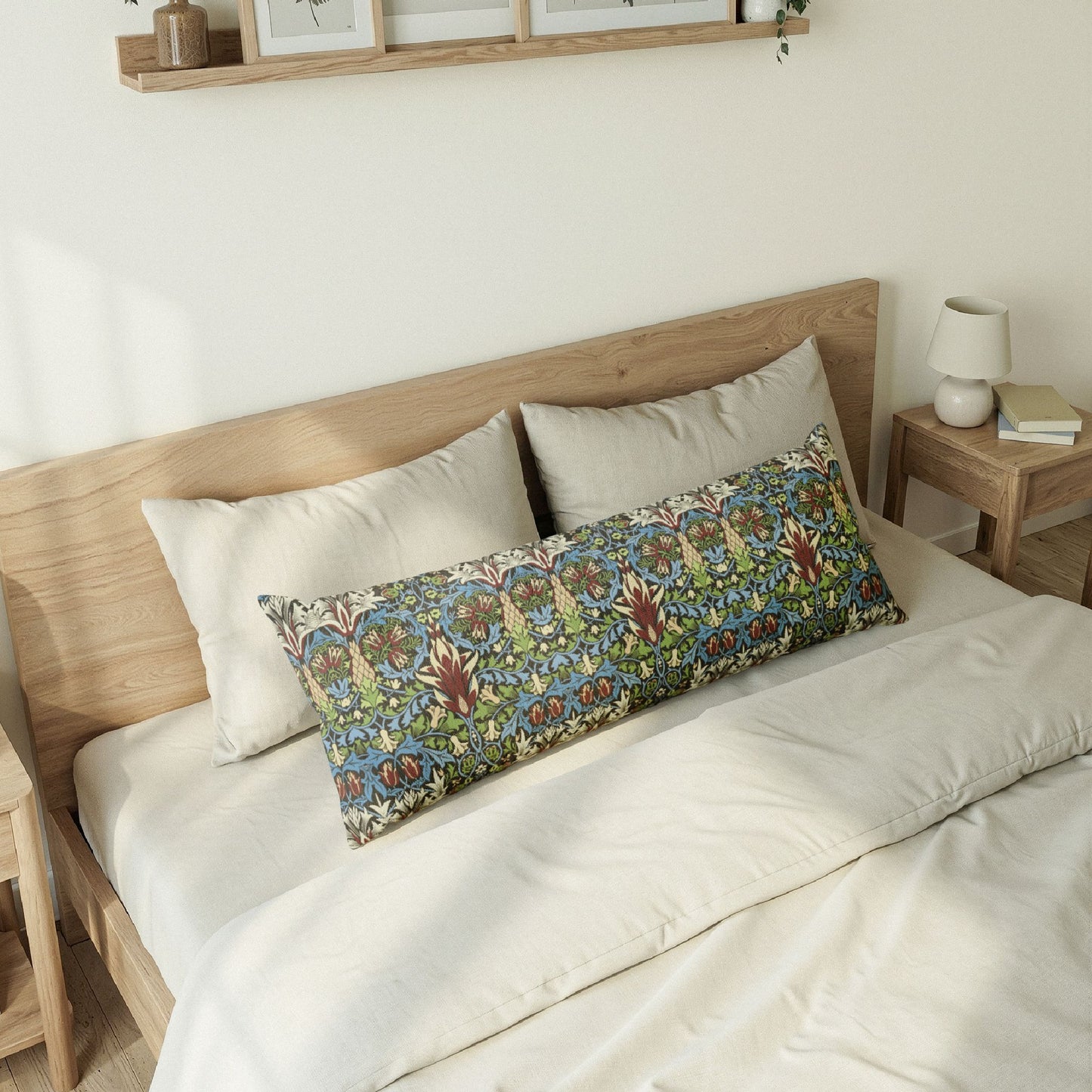 Bedroom with a wooden bed frame and floral-patterned pillow