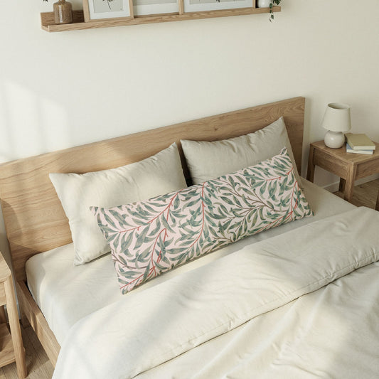Bedroom with wooden bed frame, white bedding, and decorative pillows.