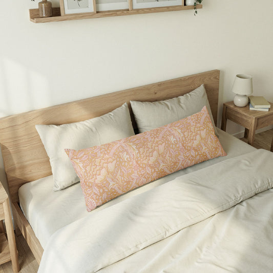 Bedroom with wooden bed frame, white bedding, and a decorative pillow.