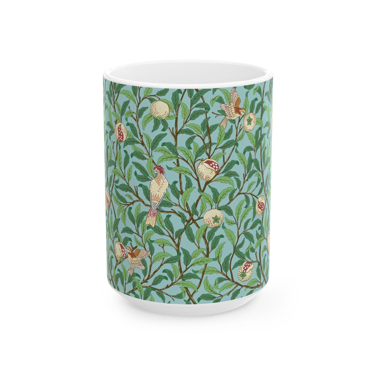 A ceramic mug with a blue background featuring a floral pattern of birds and pomegranates.