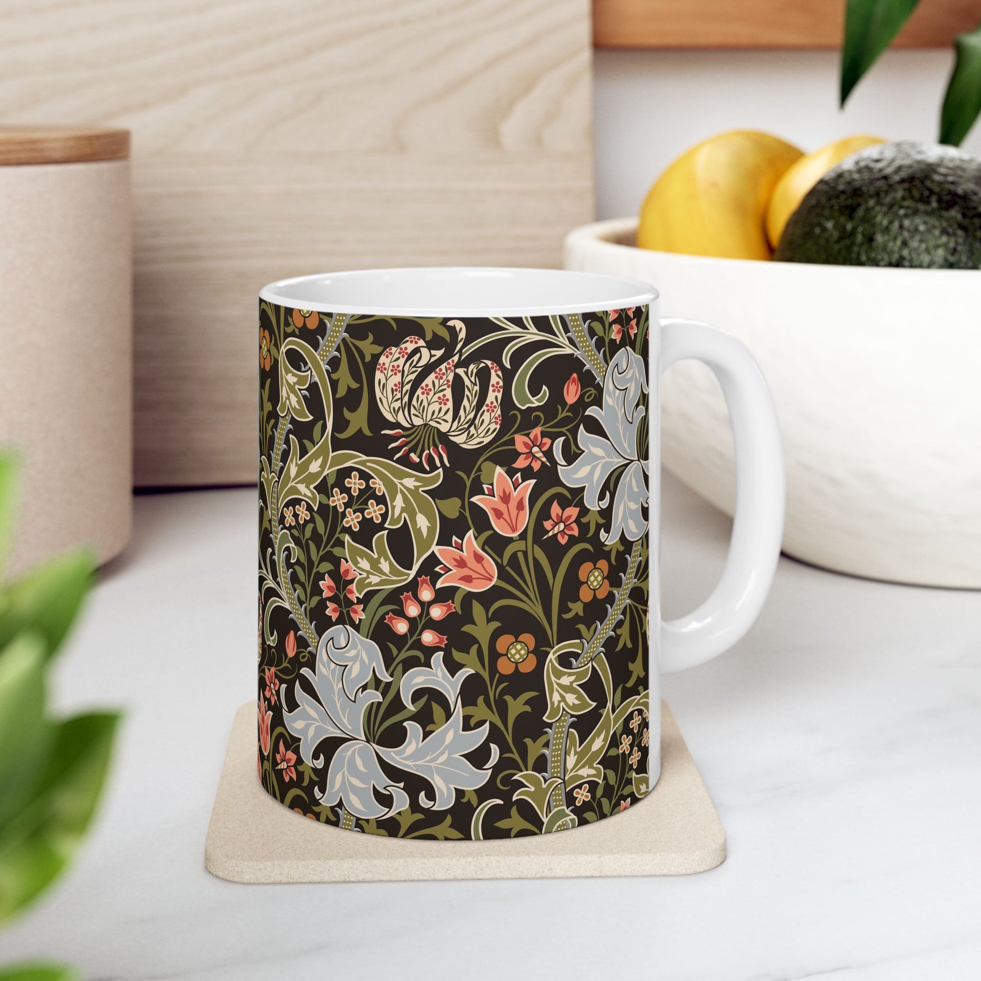 A ceramic mug with a floral pattern inspired by William Morris & Co - Golden Lily Collection in a midnight colour palette.