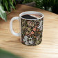 A ceramic mug with a floral pattern inspired by William Morris & Co - Golden Lily Collection in a midnight colour palette.